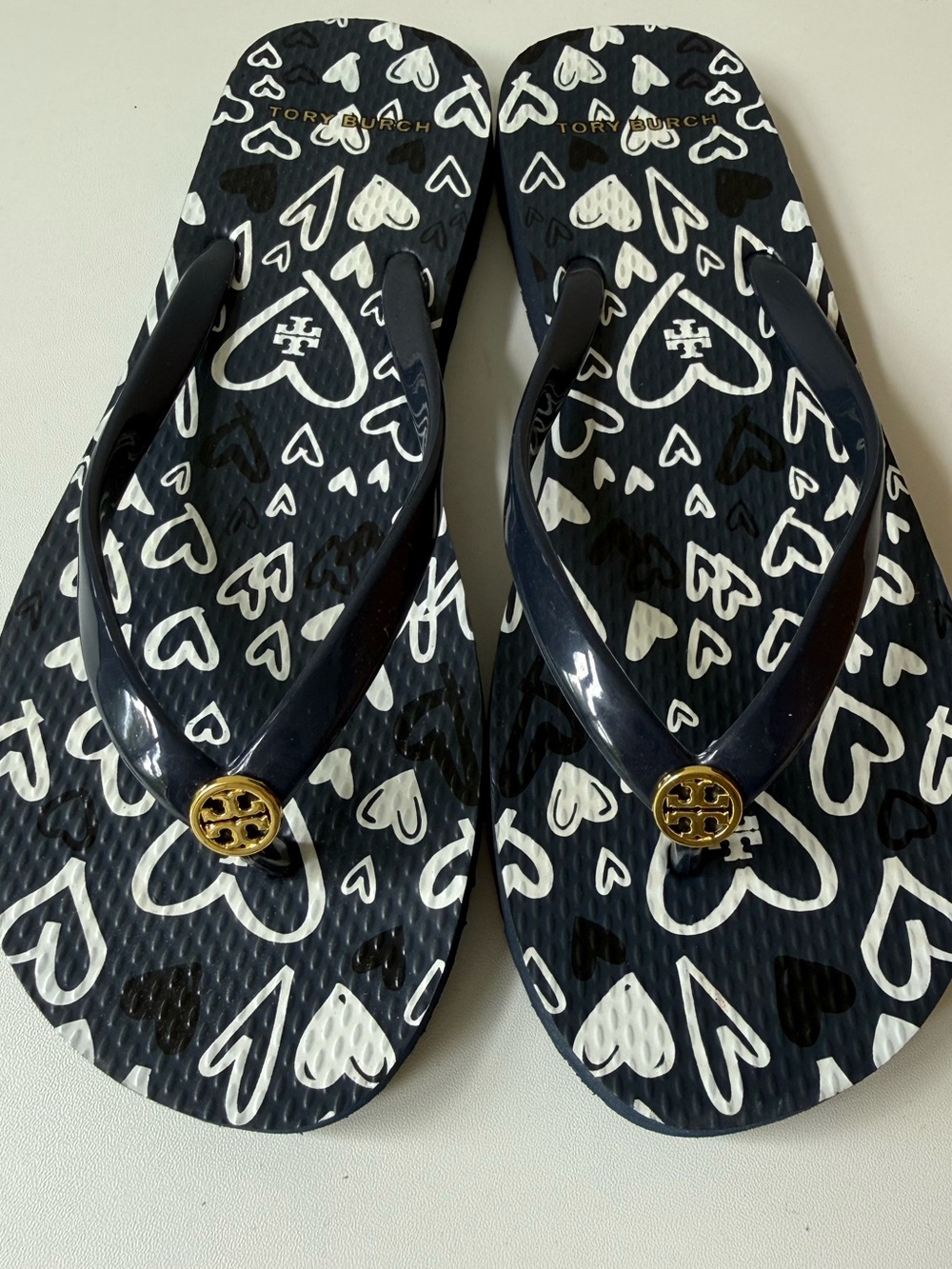 Tory Burch Navy and White Heart Pattern Flip Flops with Gold Emblem